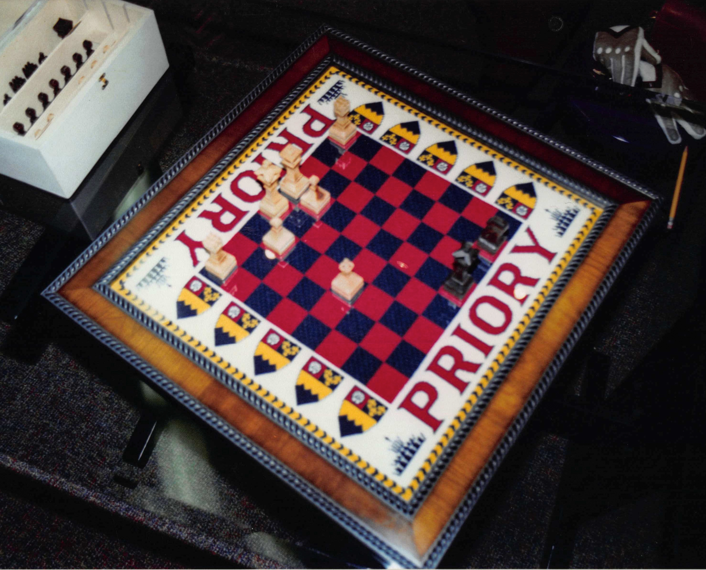 Framed chessboard and wooden pieces
